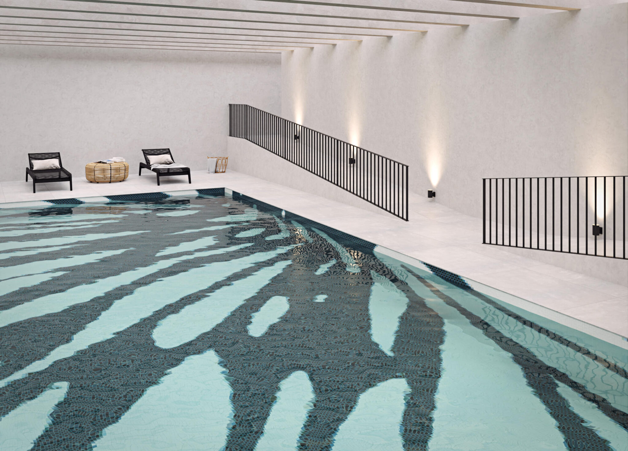 Basen z indywidualnie zaprojektowaną mozaiką w kształcie rozchodzących się plam.